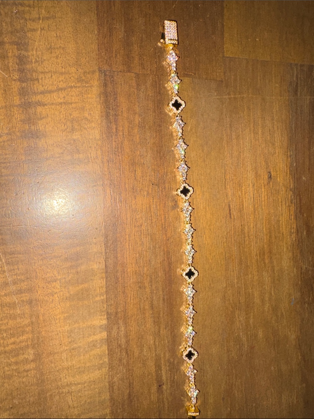 Elegant Gold-Tone Women's Bracelet with Black Accent Stones